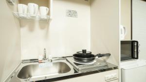 Una cocina o zona de cocina en KAMON INN AIHUKA