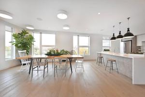 a kitchen and dining room with a table and chairs at Central Sq Studio w Doorman nr Charles River BOS-369 in Cambridge