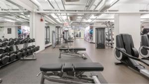 a gym with rows of chairs and machines at Spacious Beacon Hill 1BR wViews Gym BOS-498 in Boston