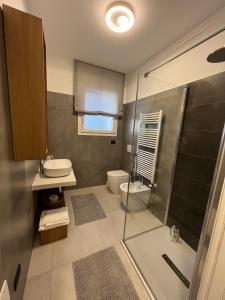a bathroom with a shower and a sink and a toilet at MyVilla - Ivrea via Jervis 22b in Ivrea