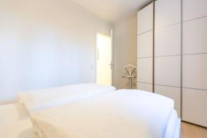 Postel nebo postele na pokoji v ubytování Villa Medici Heringsdorf App 01