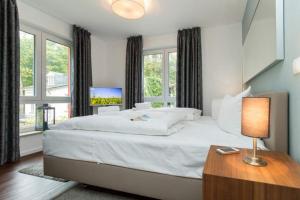 Ein Bett oder Betten in einem Zimmer der Unterkunft Villa Limora, App. 04