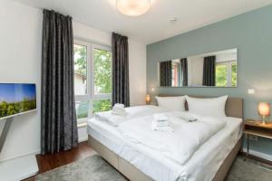 Ein Bett oder Betten in einem Zimmer der Unterkunft Villa Limora, App. 04