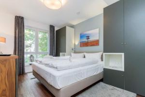 Ein Bett oder Betten in einem Zimmer der Unterkunft Villa Limora, App. 04