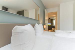 Ein Bett oder Betten in einem Zimmer der Unterkunft Villa Limora, App. 04