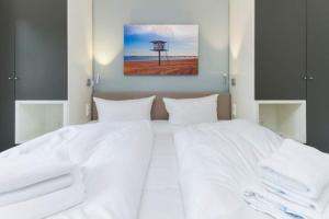 Ein Bett oder Betten in einem Zimmer der Unterkunft Villa Limora, App. 04