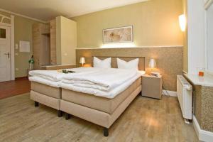 Postel nebo postele na pokoji v ubytování Villa Dora App 02