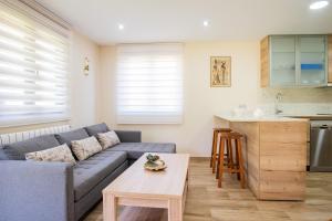 A kitchen or kitchenette at Apartamentos La Cortina