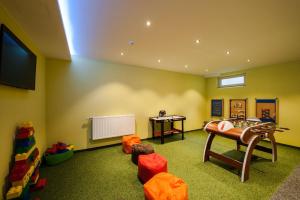 TV a/nebo společenská místnost v ubytování Rustika - Appartements & Spa
