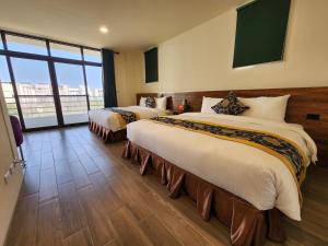 Postelja oz. postelje v sobi nastanitve Penghu Dayou View B&B