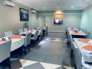 A television and/or entertainment centre at Msquare Hotel GRA