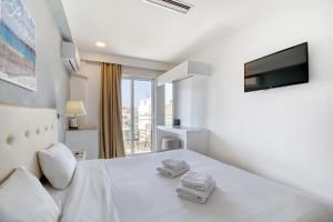 Postel nebo postele na pokoji v ubytování Astron Hotel Rhodes + 37 fotografií