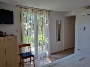 TV a/nebo společenská místnost v ubytování Guesthouse Dominović