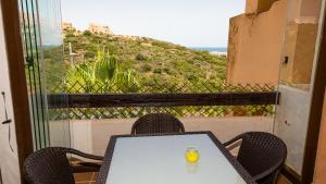 a table and chairs with a view of a mountain at Duquesa Village 7,19,12 in Manilva