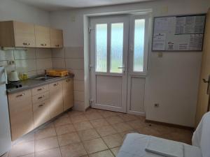 Kuchyň nebo kuchyňský kout v ubytování Guesthouse Dominović