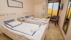 Postel nebo postele na pokoji v ubytování Duquesa Village 16,62,32