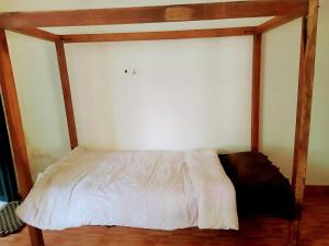 Ein Bett oder Betten in einem Zimmer der Unterkunft Tharu Lodge