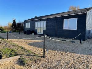 a house with a rope attached to it at Poplar holiday cottage in Moulton Chapel
