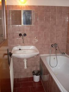 a bathroom with a sink and a bath tub at Horska Chata Nejdecka in Pernink