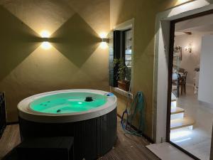 a jacuzzi tub in the middle of a house at Palazzo Veneziano direct at the canal with roof terrace in Venice