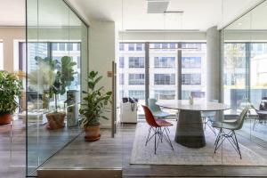 an office with a table and chairs and windows at Clinton Hill 2br w gym pool wd nr Barclays NYC-1025 in Brooklyn