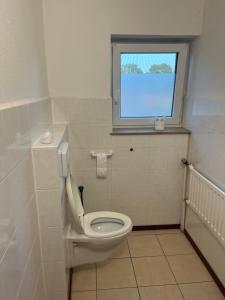 Koupelna v ubytování Dorfblick-Emsland + 23 fotografií