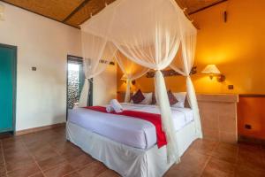 Ein Bett oder Betten in einem Zimmer der Unterkunft Umasari Rice Terrace Villa by AGATA