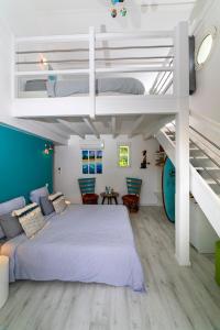 a bedroom with a bunk bed and a staircase at Côte et Dune in Biscarrosse-Plage +50 photos