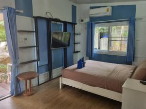 Postel nebo postele na pokoji v ubytování Rayonghouse Resort