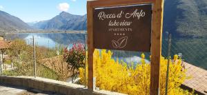 a sign for a restaurant with a view of a lake at Rocca d'Anfo B&B-Apartments Lake View in Rocca dʼAnfo