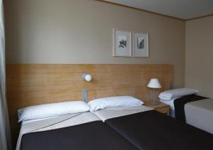 Postel nebo postele na pokoji v ubytování Eurohotel Castellón
