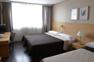 Postel nebo postele na pokoji v ubytování Eurohotel Castellón
