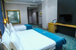 Postel nebo postele na pokoji v ubytování Iris Hotel Baku - Halal Hotel