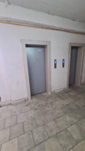 an empty room with two doors and a tile floor at vazisubani, shandor pedef 7 balavari in Tbilisi City