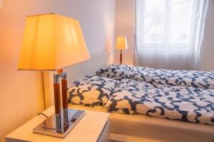 Кровать или кровати в номере Family&Friends Apartments Schönbrunn