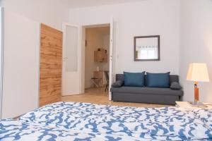 Кровать или кровати в номере Family&Friends Apartments Schönbrunn