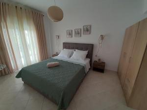 Postel nebo postele na pokoji v ubytování Giotouli Apartment