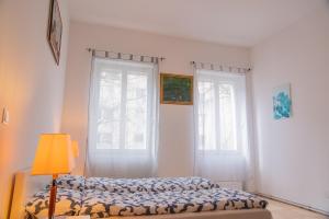 Кровать или кровати в номере Family&Friends Apartments Schönbrunn