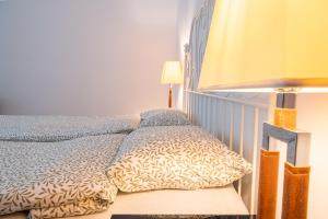Кровать или кровати в номере Family&Friends Apartments Schönbrunn