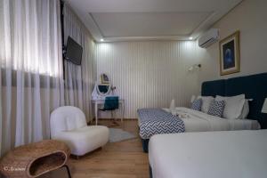 Voodi või voodid majutusasutuse Hôtel ZIRYAB toas