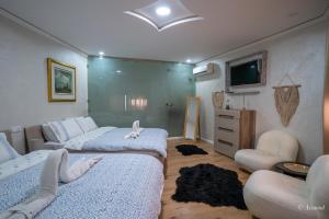 Voodi või voodid majutusasutuse Hôtel ZIRYAB toas