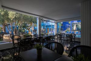 a row of tables and chairs in a restaurant at H&ocirc;tel ZIRYAB in Chefchaouene