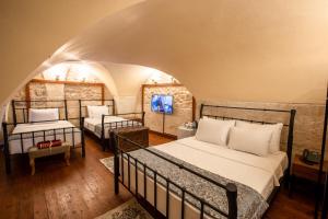 En eller flere senge i et værelse på VE HOTELS ŞANLIURFA