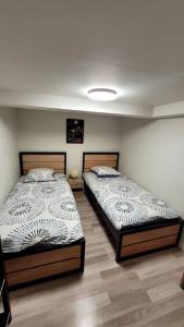 Un ou plusieurs lits dans un hébergement de l'établissement Appart 2 chambres avec extérieur