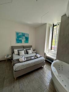a bedroom with a bed and a bath tub at The Secret Garden in Salerno +70 photos