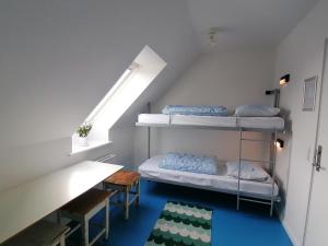 Postel nebo postele na pokoji v ubytování Femmasteren Hotel & Hostel