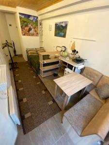 a living room with a couch and a table at Guest Room "Trip Spirit" in Tbilisi City
