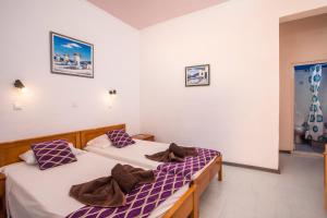 Postel nebo postele na pokoji v ubytování Faliro Hotel