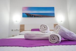 Postel nebo postele na pokoji v ubytování Hostal Los Mellizos + 37 fotografií