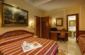 Postel nebo postele na pokoji v ubytování Hotel Bolivar + 28 fotografií